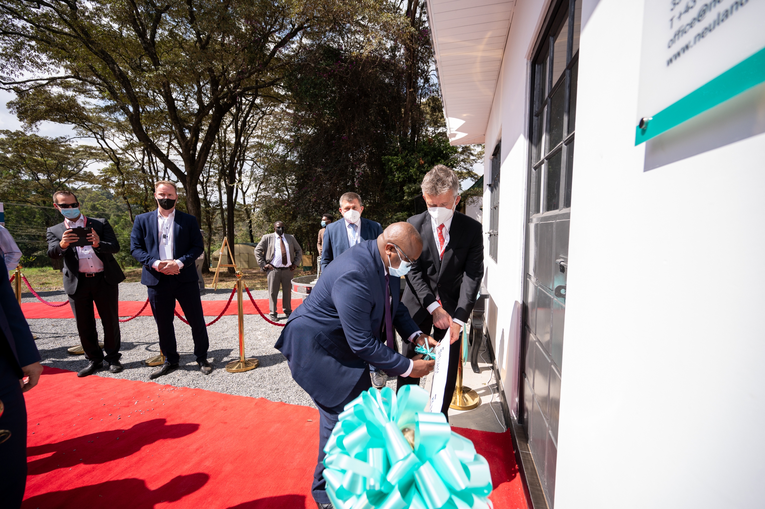 Businessman cuts the ribbon as the highlight of the opening ceremony in front of the entrance of the show house at the NCA show ground in Kenia